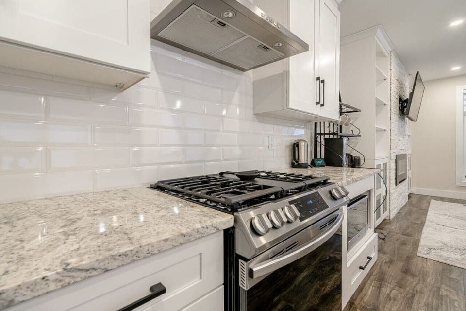 Cooking Area with plenty of counter space, gas stove and oven, microwave.