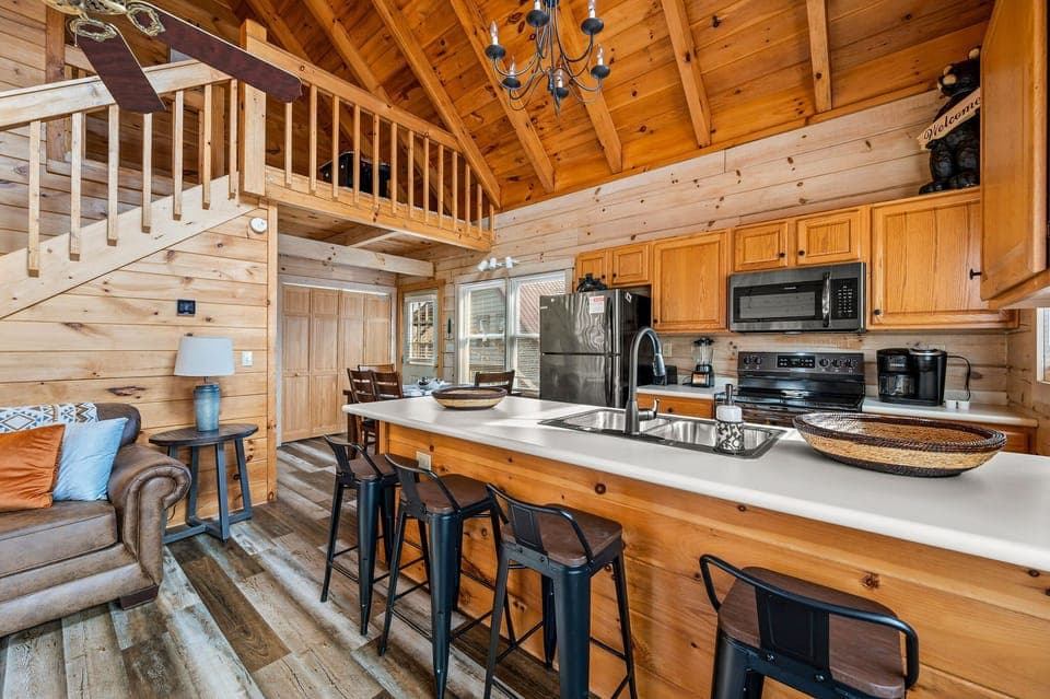 Stocked kitchen w/ stove, fridge, dishwasher, sink, microwave, and coffee maker