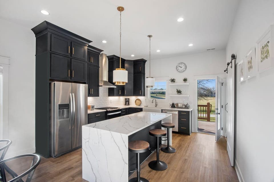 Marble peninsula features extra counter stools