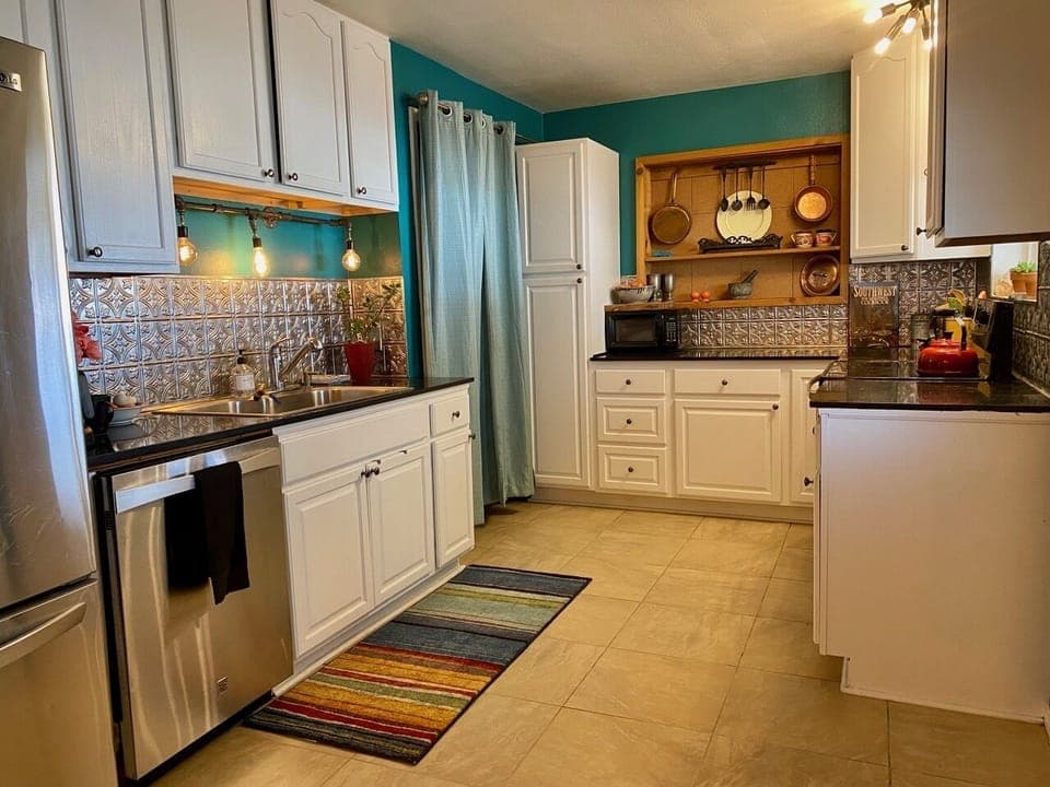 Main Kitchen. The other adjoining side in this listing also has a mini kitchen