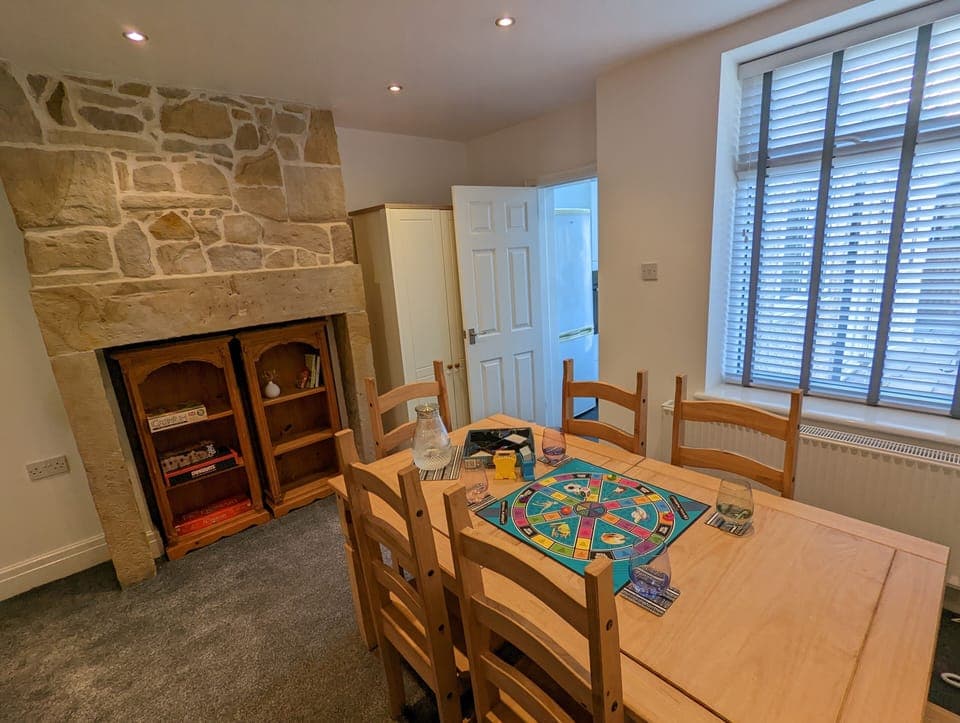 Dining table, comfortably seating six for group dining and/or board games.