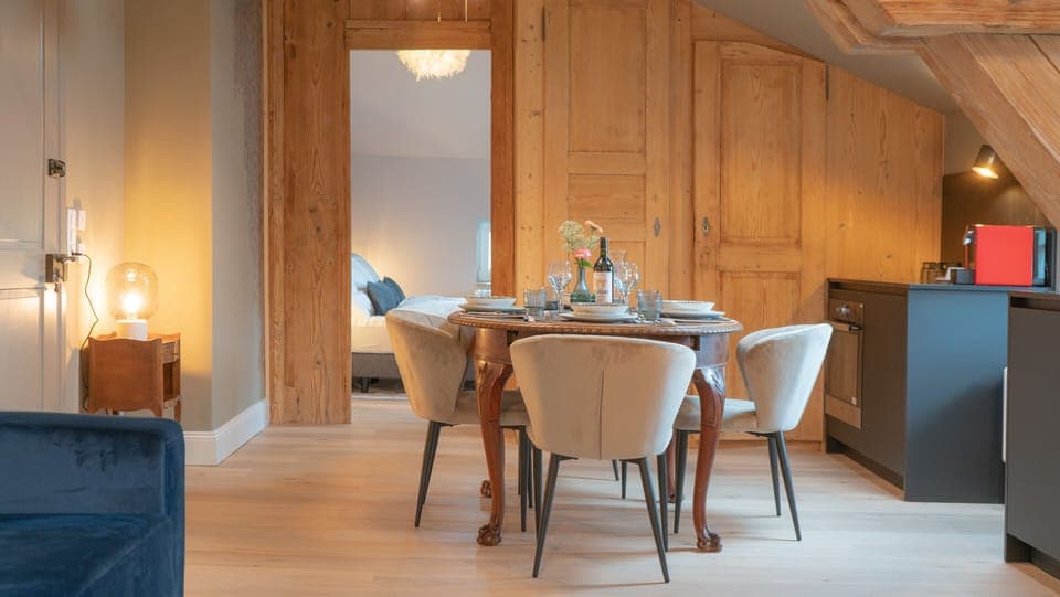 Attic Suite with Kitchenette | Living area | 40-inch LED TV with satellite channels, TV