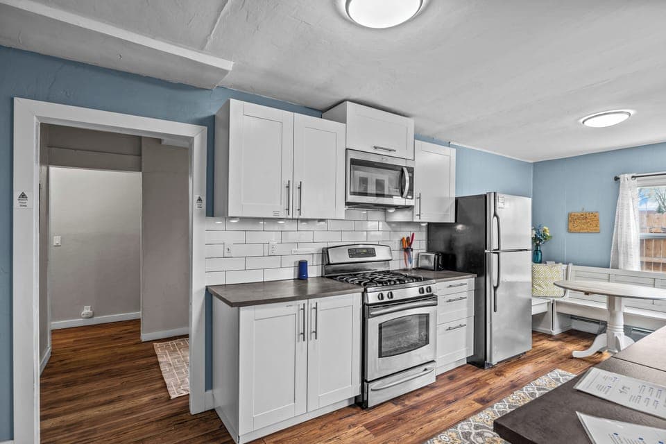Kitchen & dining area, bluetooth speaker, ample cooking supplies & dishes.