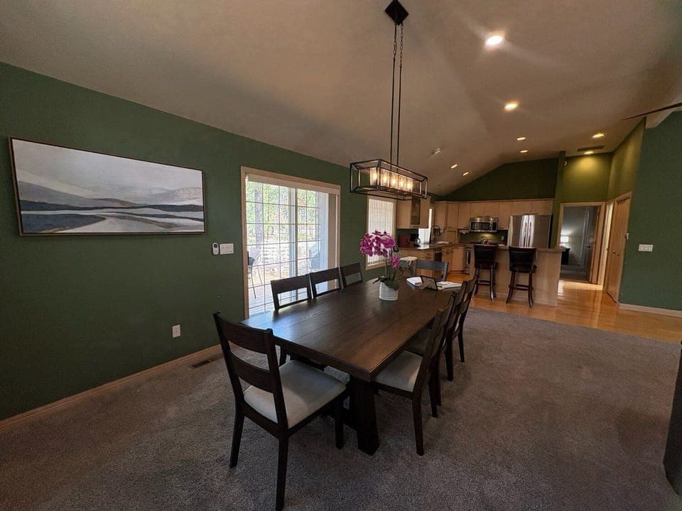 Gather around your elegant dining table for memorable meals with loved ones in this beautifully appointed open-concept space.
