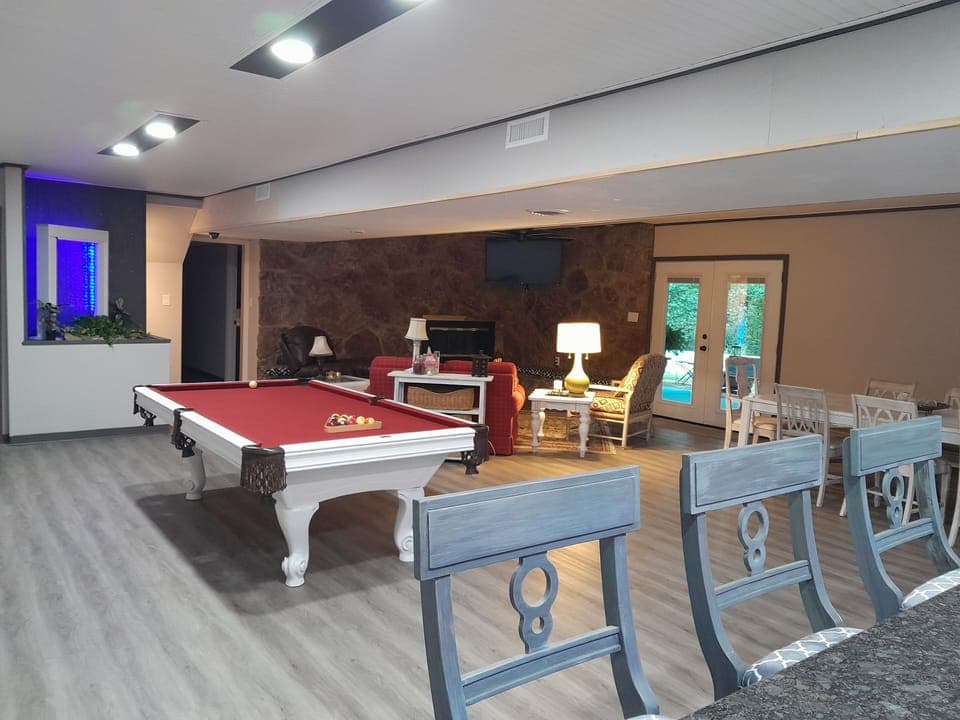 Main room features regulation pool table.