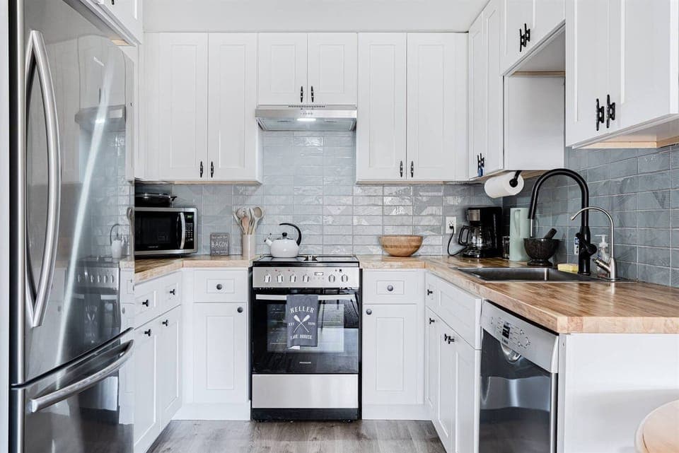Tiny but mighty kitchen. Full-sized fridge, apartment-sized oven range/stove plus full-sized extra quiet Bosch dishwasher.