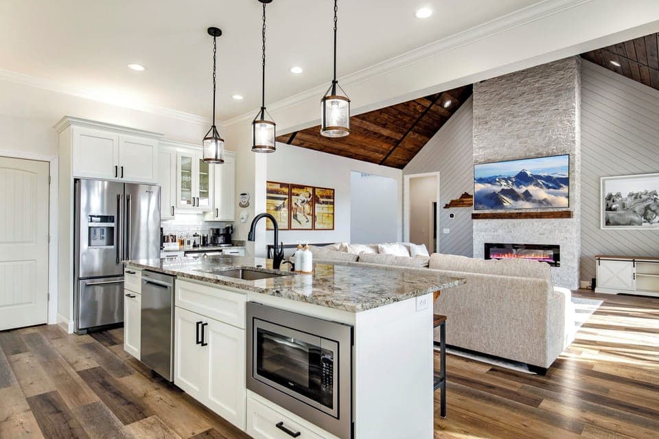 Cook, gather, and unwind in this open kitchen with an 85” TV after a day on the Kentucky Bourbon Trail.