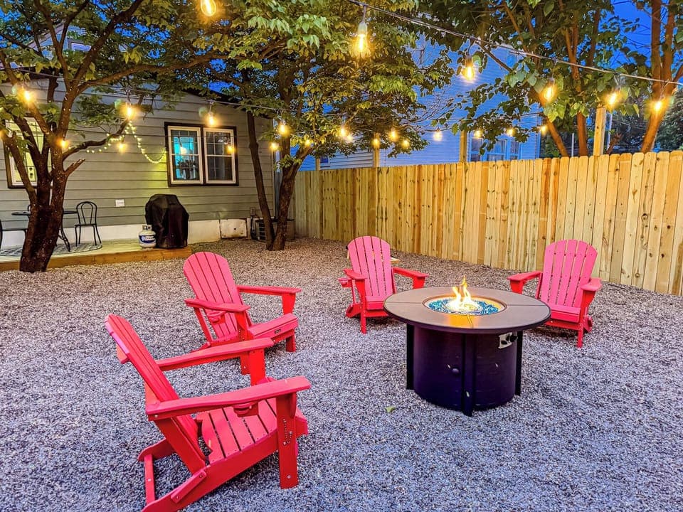 Twinkling lights cast a warm glow in the backyard.