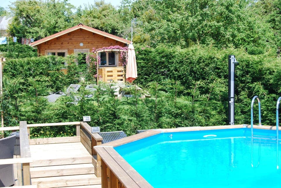 The cabin is just a few steps away from the pool though your private garden