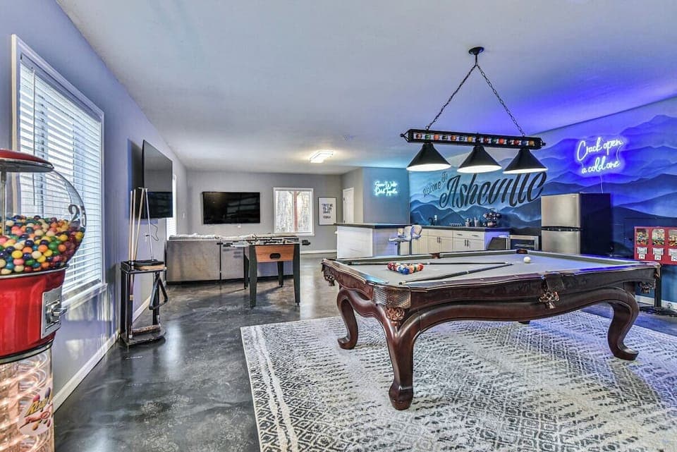 Billiards, Indoor Bar,  Shuffleboard, Fooseball, life size connect 4, and two 75" HDTV's in one entertainment area