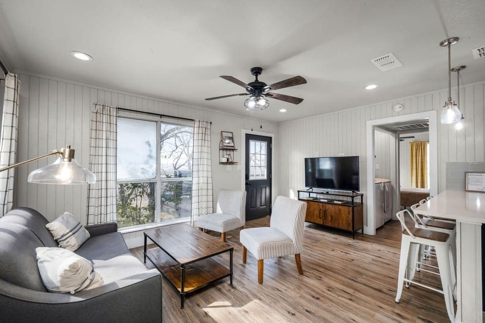 [B's Bunkhouse] Enjoy comfort and great views in this cabin’s inviting living area.