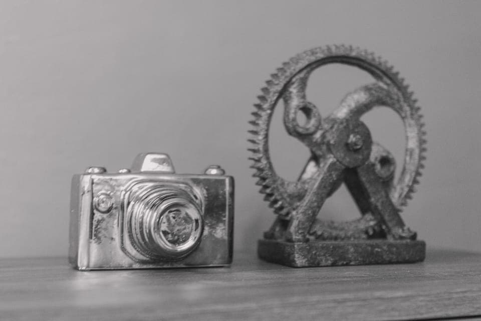 Eye catching ceramic gear and camera sculpture