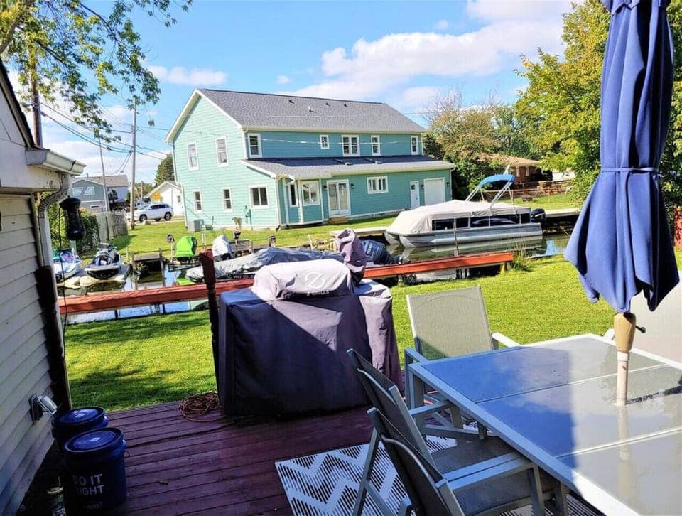 Outdoor space, featuring patio, canal dock, and smoker/BBQ Grill