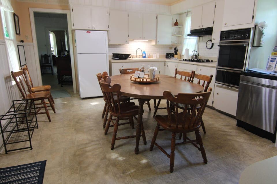 Full kitchen: stove, oven, microwave, dishwasher, frig, pots, pans, dishes etc.