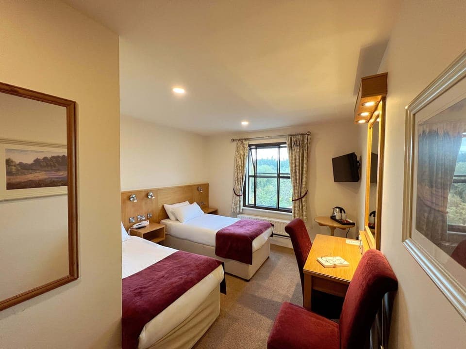 Twin Room | Desk, laptop workspace, blackout drapes, iron/ironing board