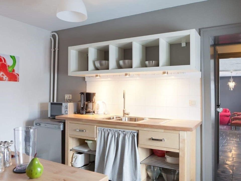 Bungalow | Private kitchen | Fridge, electric kettle, highchair