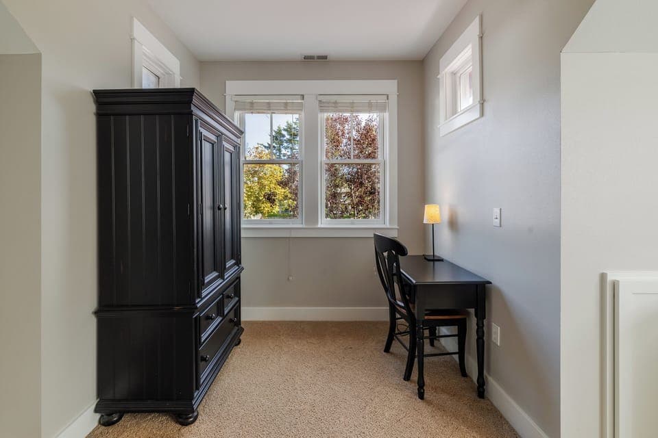 The spacious primary bedroom offers comfort and tranquility for the perfect stay