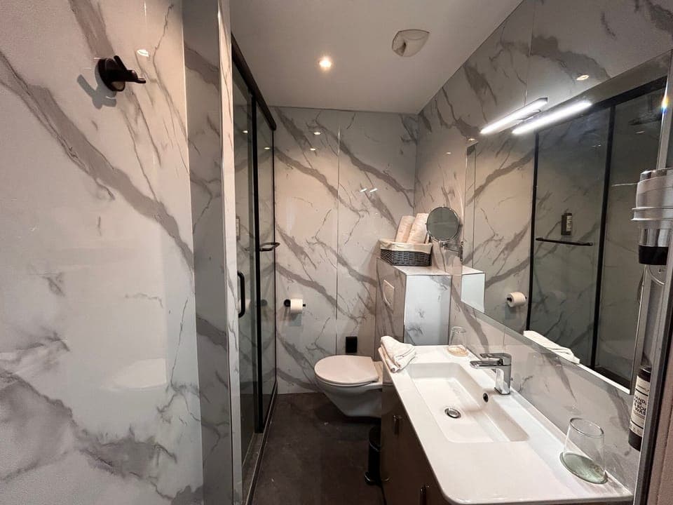 Designer toiletries, hair dryer, towels, soap