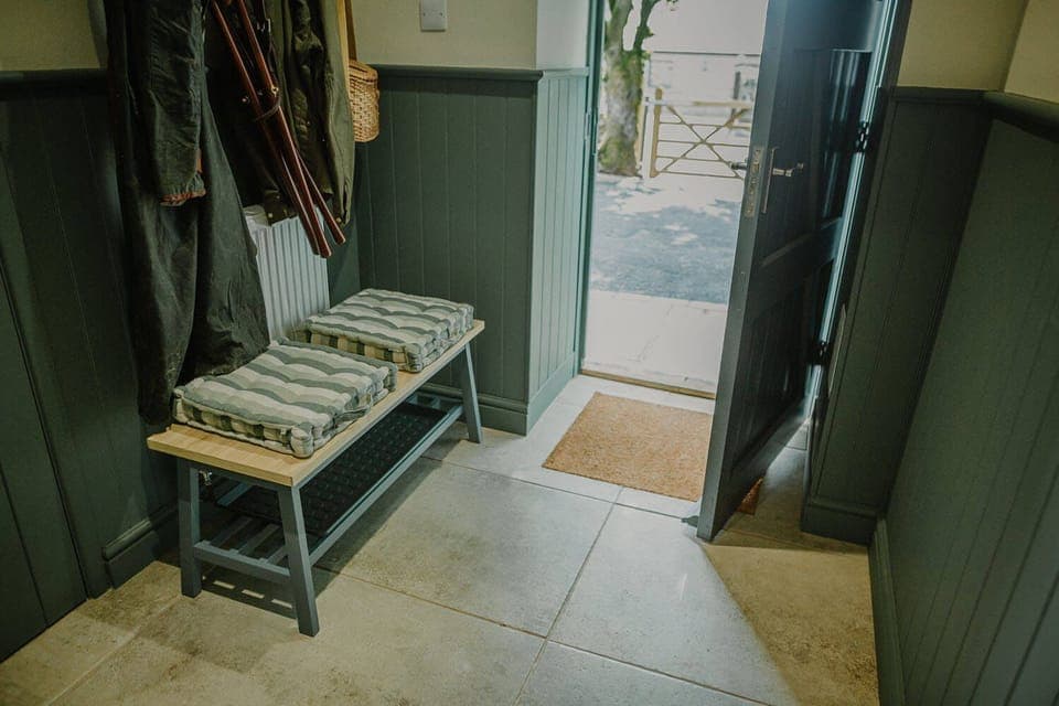Ground floor: Entrance with boot room, storage & hanging