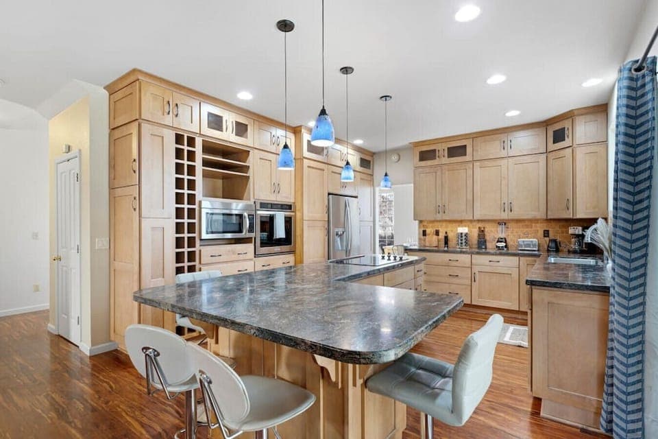 Our open concept kitchen is fully updated with modern counter tops, storage, and appliances.
