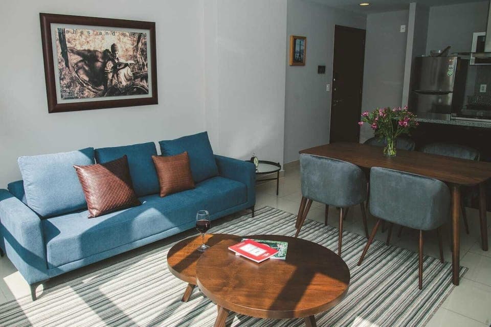 
Step into our elegant room featuring a comfortable couch and ample natural light streaming through the large window. The modern and classy design is accentuated by neutral colors, creating a soothing ambiance. Gather around the table for four, perfe