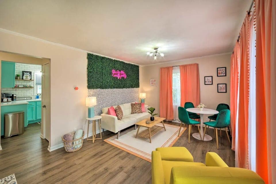 Upstairs living/dining combo with futon, smart TV and photo op w/ light-up neon!