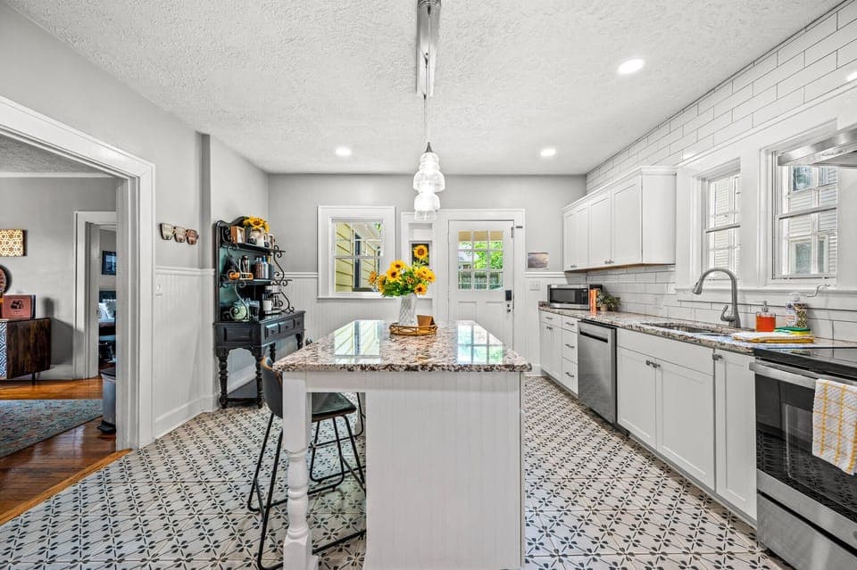 The well- stocked kitchen is equipped with everything you need to make a home cooked meal. It is a great place to gather and talk about your day while sipping on your favorite bourbon.