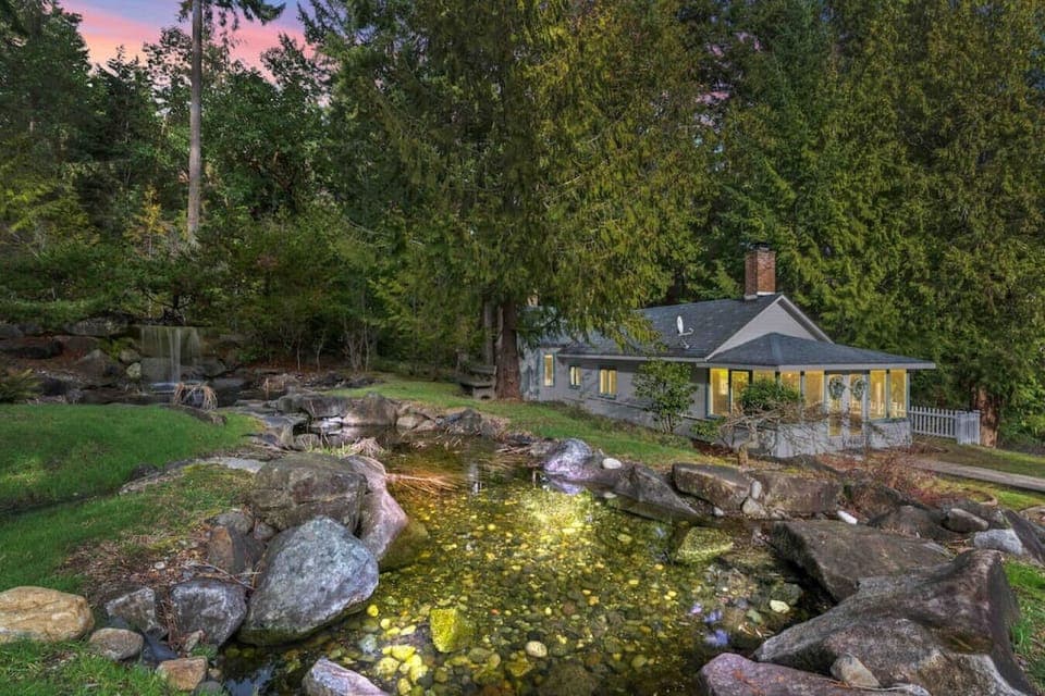 Beautiful pond and waterfall next to the house and can be seen from windows!