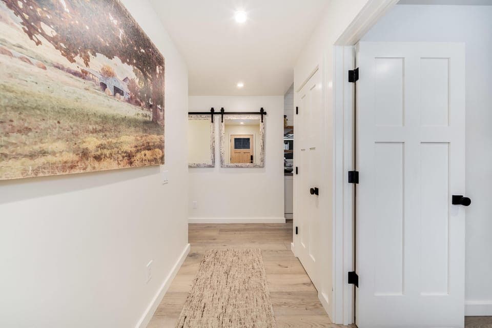 Bright, airy entryway with stylish farmhouse charm
