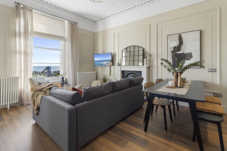 Living room and dining area with stunning sea views