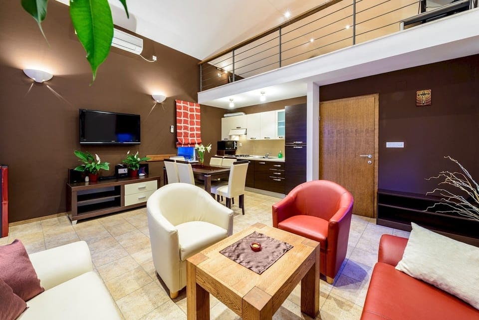 Open plan living room with kitchen and dining area