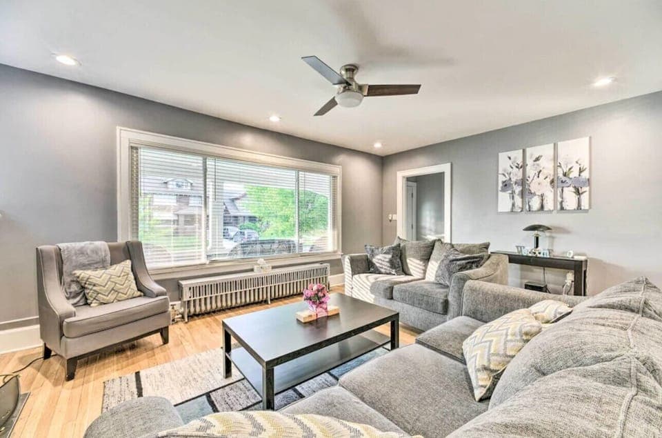 Bright living area with large windows and modern furnishings