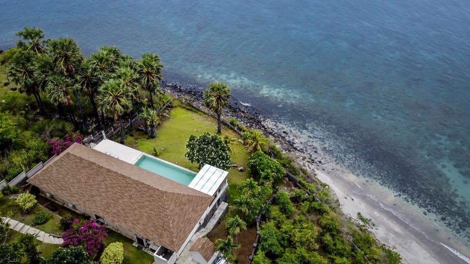 Drone view of the villa and natural surroundings 