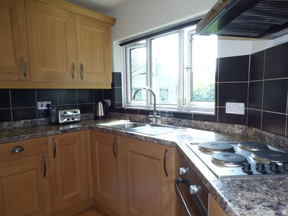 Fridge, electric kettle, toaster, cookware/dishes/utensils