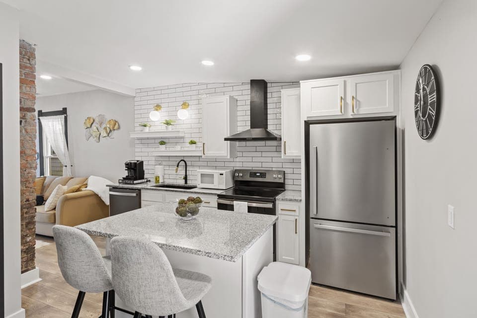 Marble peninsula features two extra counter stools