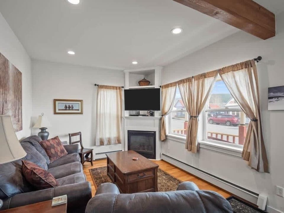 【Living Room】 Gas fireplace crackles on cool Leadville nights — Victorian bones, updated comfort.