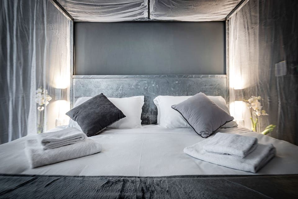 Deluxe Double Room, River View | Minibar, in-room safe, individually furnished, iron/ironing board