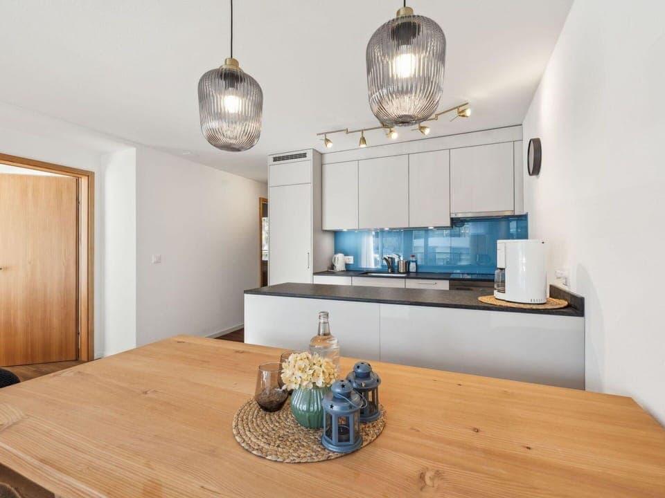 Interior Design, Furniture, Flooring, Countertop, Light Fixture, Wood, Ceiling, Kitchen, Floor, Cabinetry