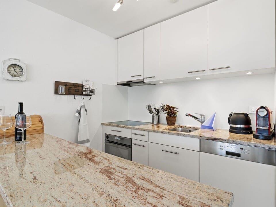 Cabinetry, Countertop, Property, Sink, Tap, Bottle, Kitchen Stove, Wood, Drawer, Flooring