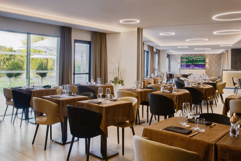 Breakfast, lunch, dinner served; French cuisine, golf course views 