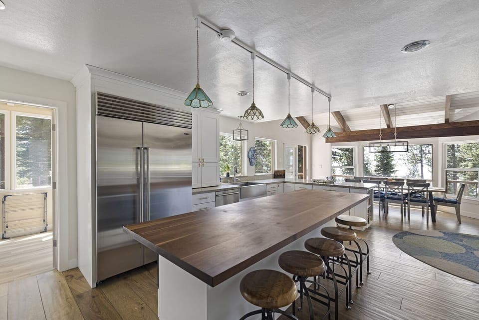 Fully stocked kitchen and island for group cooking.