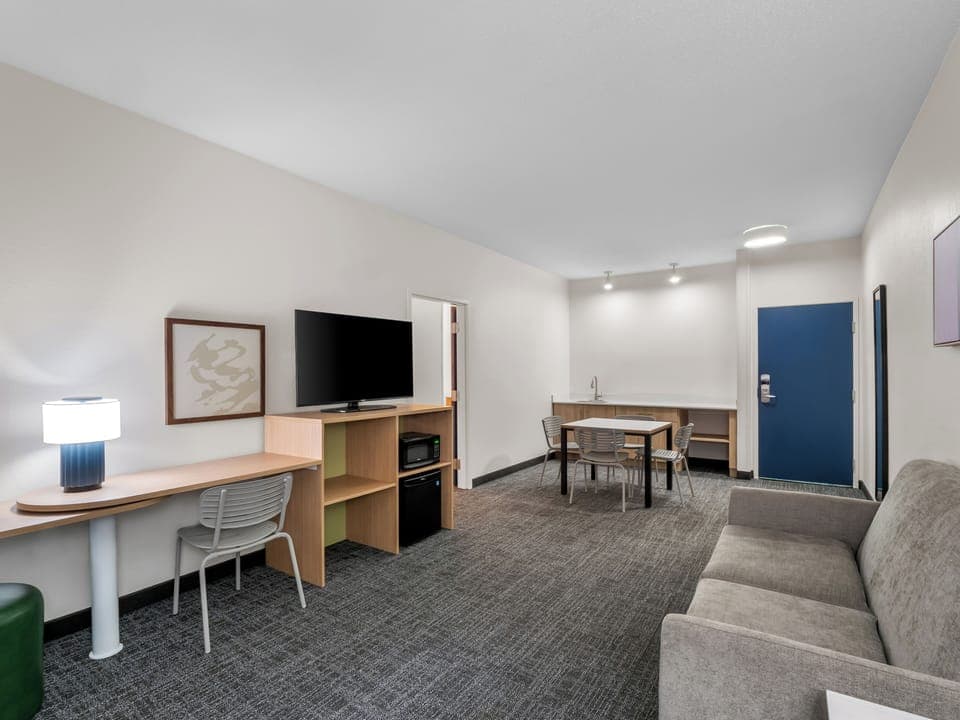 Suite, 1 King Bed | Desk, laptop workspace, blackout drapes, iron/ironing board