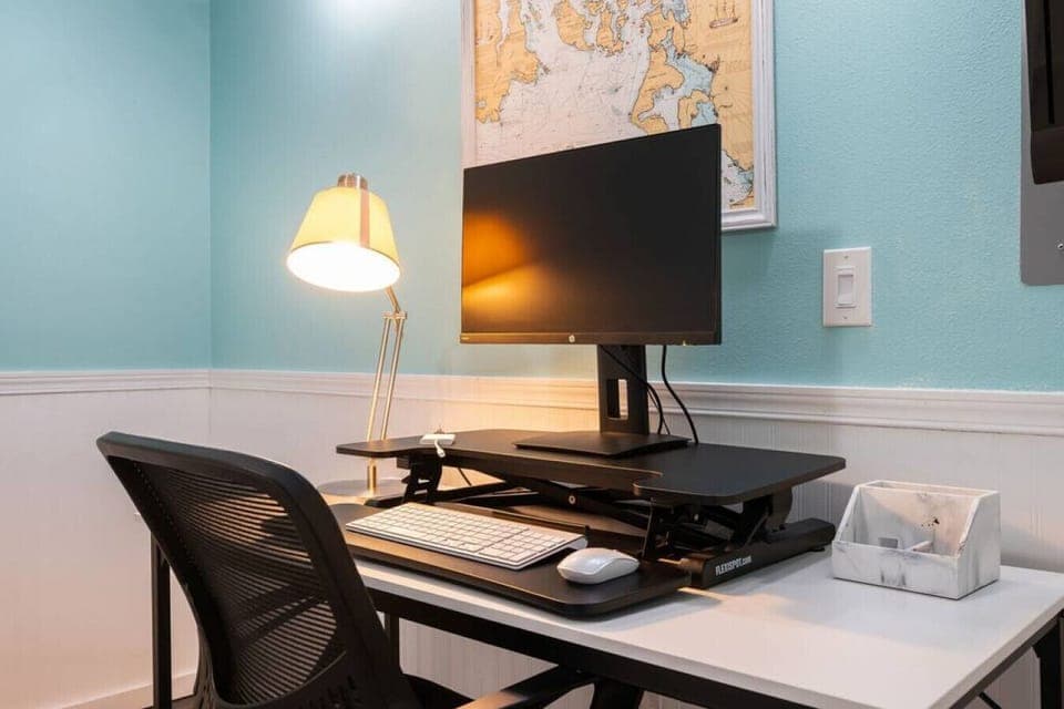 Desk, monitor, mouse, keyboard, and convertible sit/stand is provided so you can easily work while you are away.