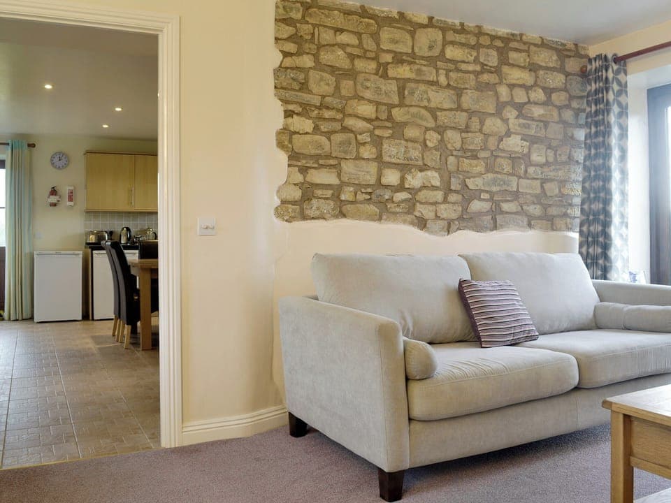 Living room is conveniently situated next to kitchen/diner | The Creamery, North Wootton, near Wells