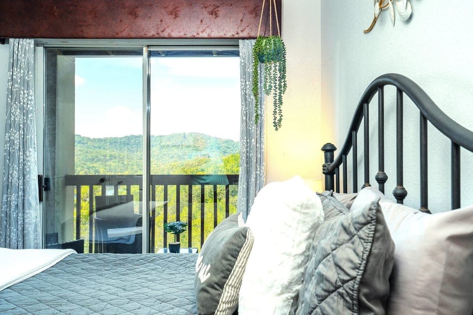 The master bedroom also has a sliding door to the private deck - the perfect spot to savor a morning cup of coffee while taking in the nature all around