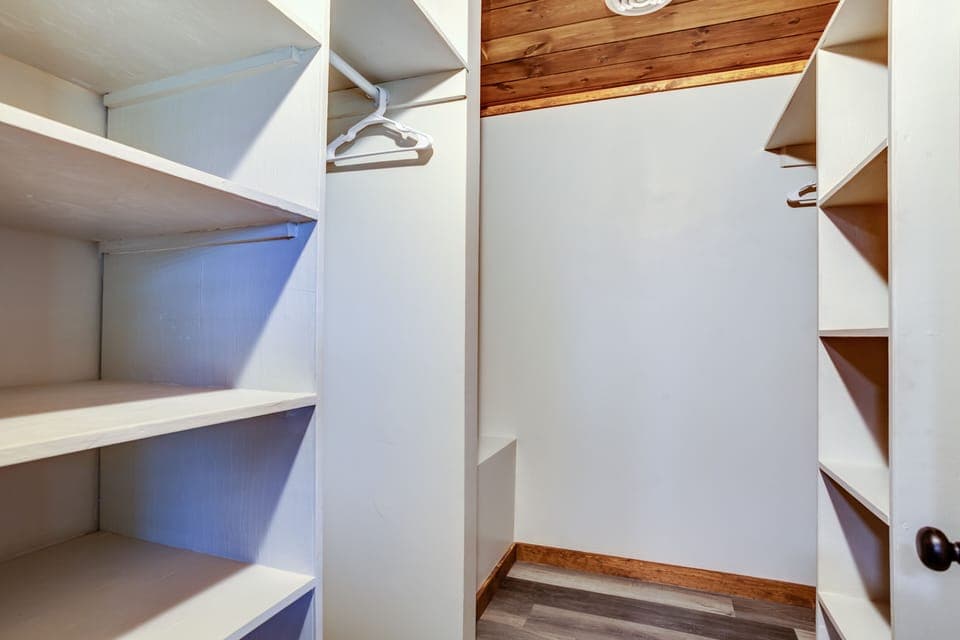 Enormous walk in closet in master bedroom