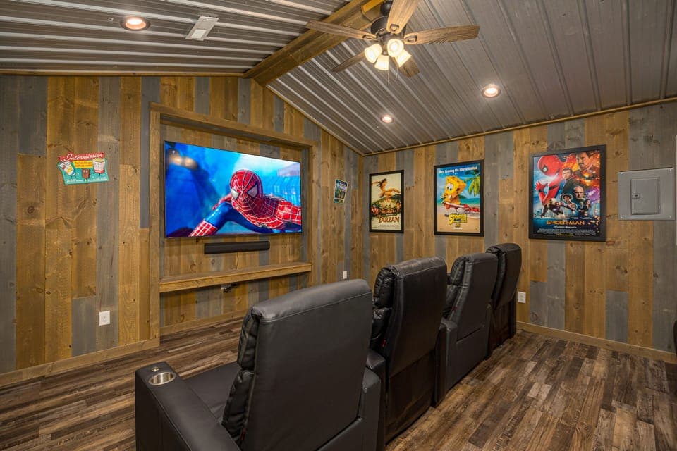 Lower level movie theater with cushy seating