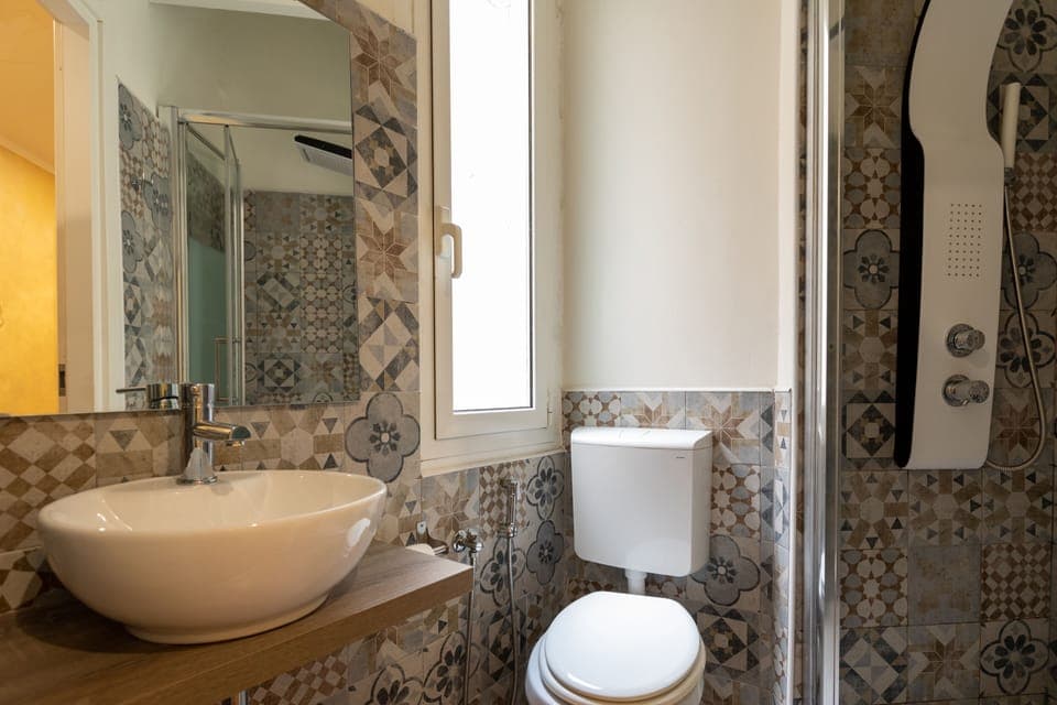 Shower, rainfall showerhead, hair dryer, towels