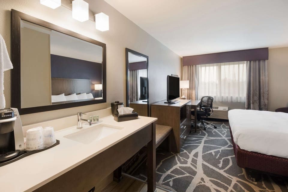 Desk, laptop workspace, blackout drapes, iron/ironing board