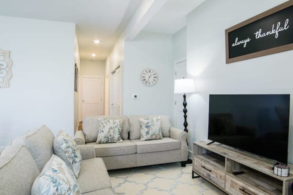 Lovely living area with smart tv and two comfy loveseats.